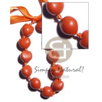 Kukui nuts in pearlized orange