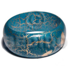 Natural wood bangle in ocean
